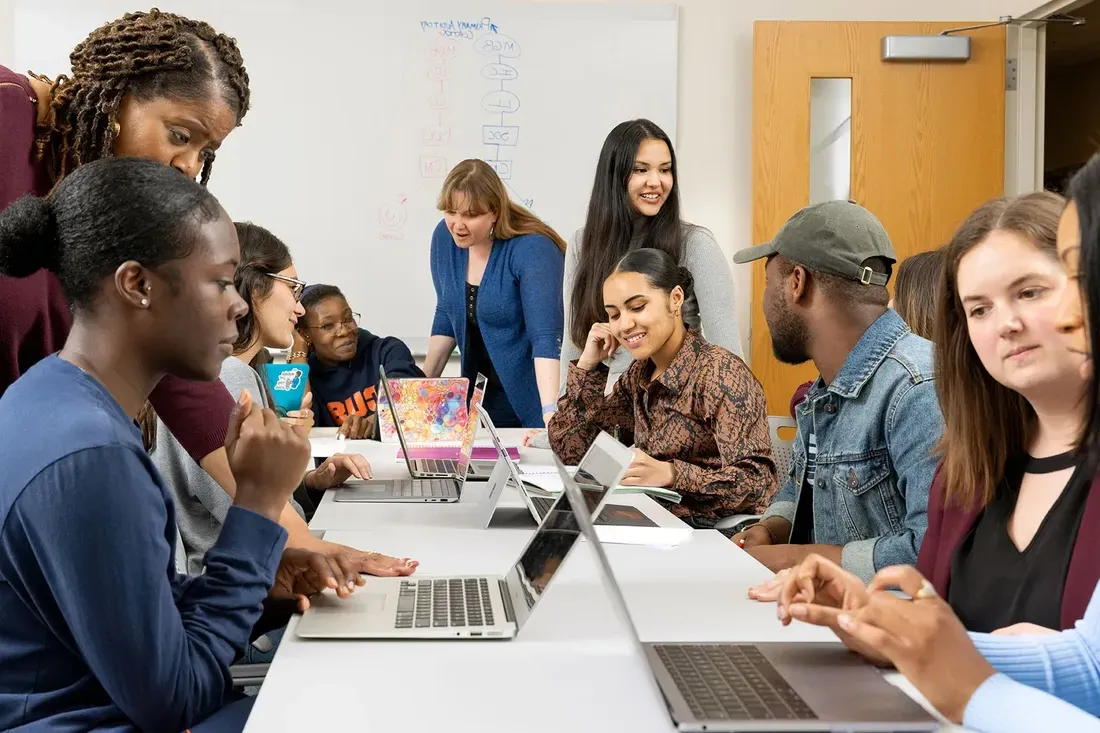 Students working together in a classroom.