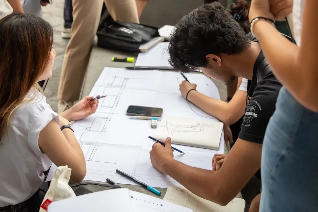 Architecture students sketching on paper in Florence, Italy.